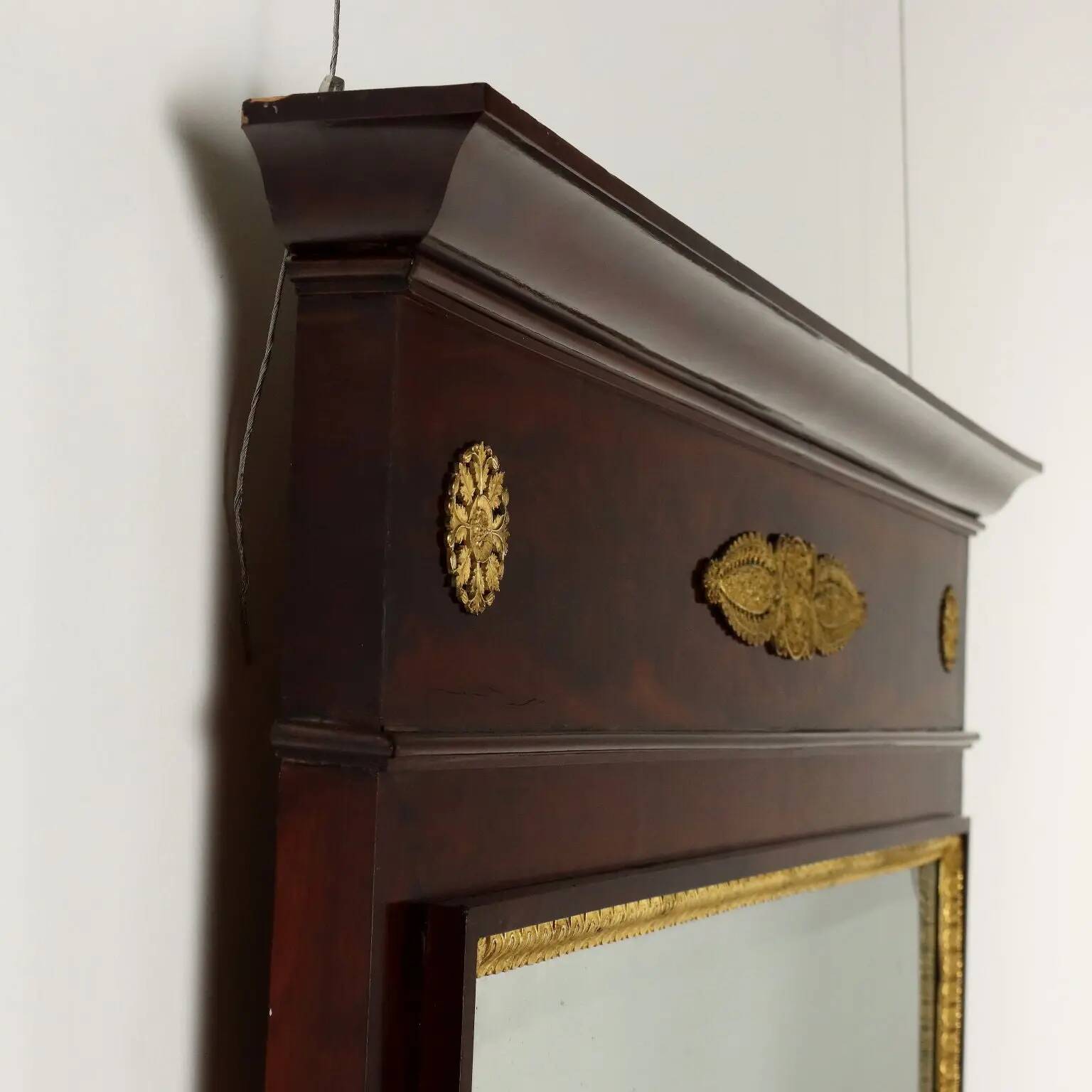 Antique Empire fireplace mirror in mahogany with a bronze frame, Italy, 19th century.