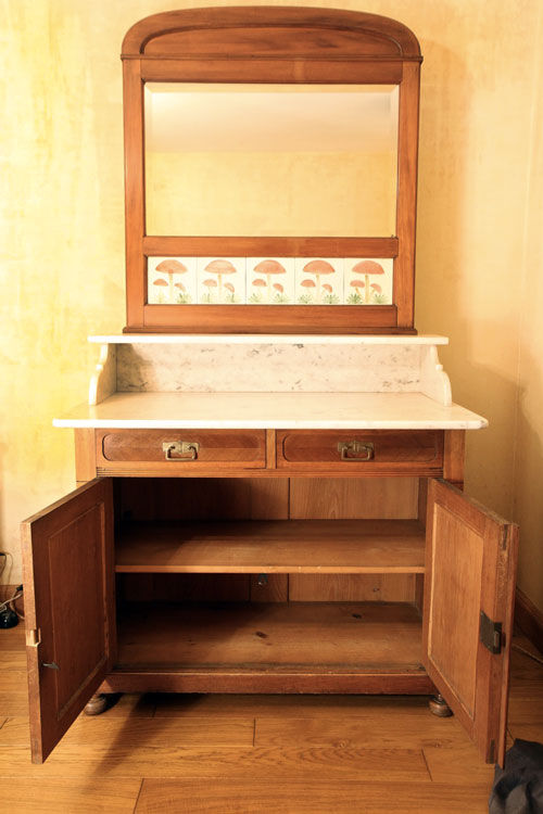 Vintage vanity toilet furniture with marble top.