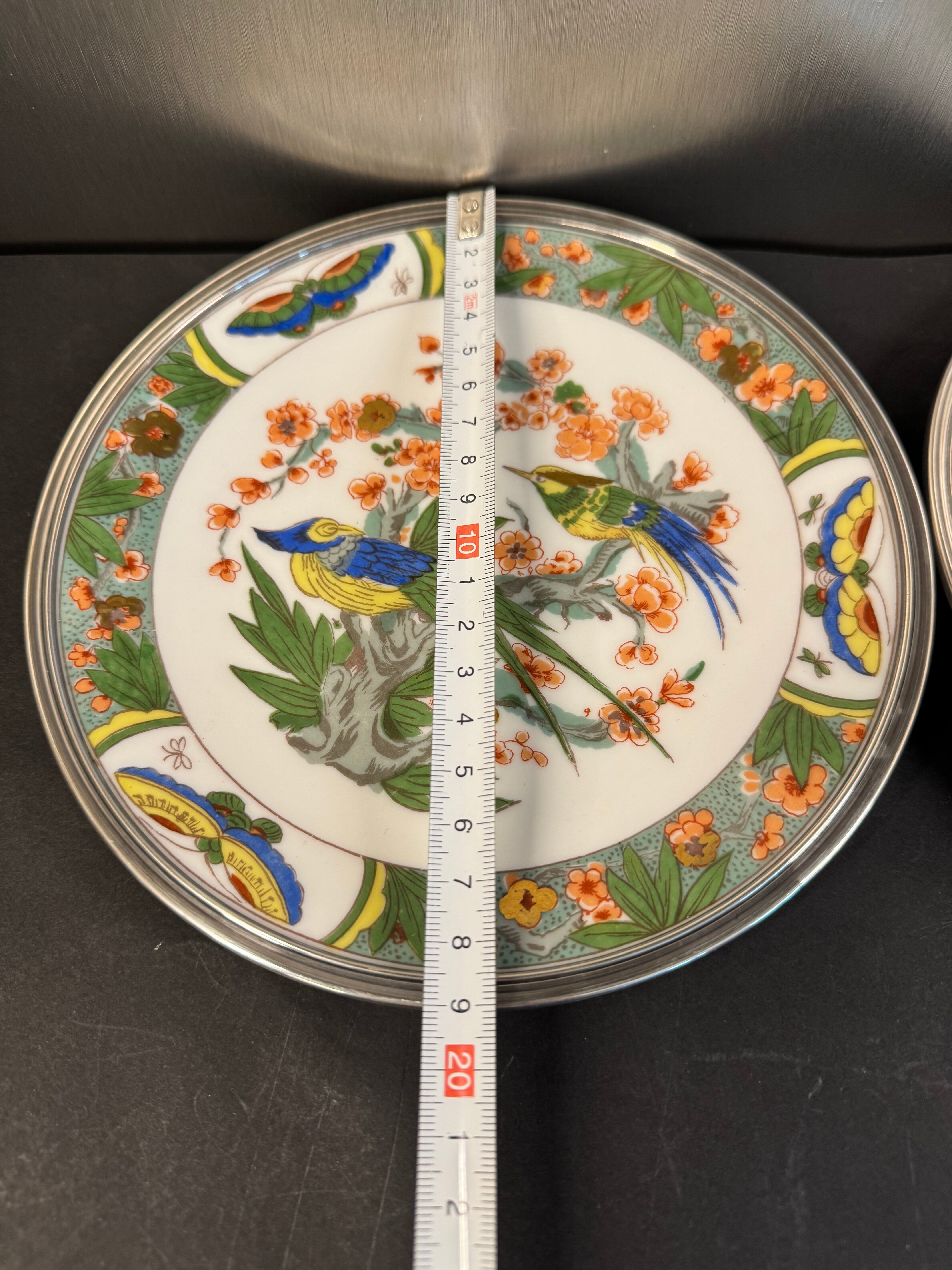 Two Raynaud Limoges plates and Tetard brothers silver.