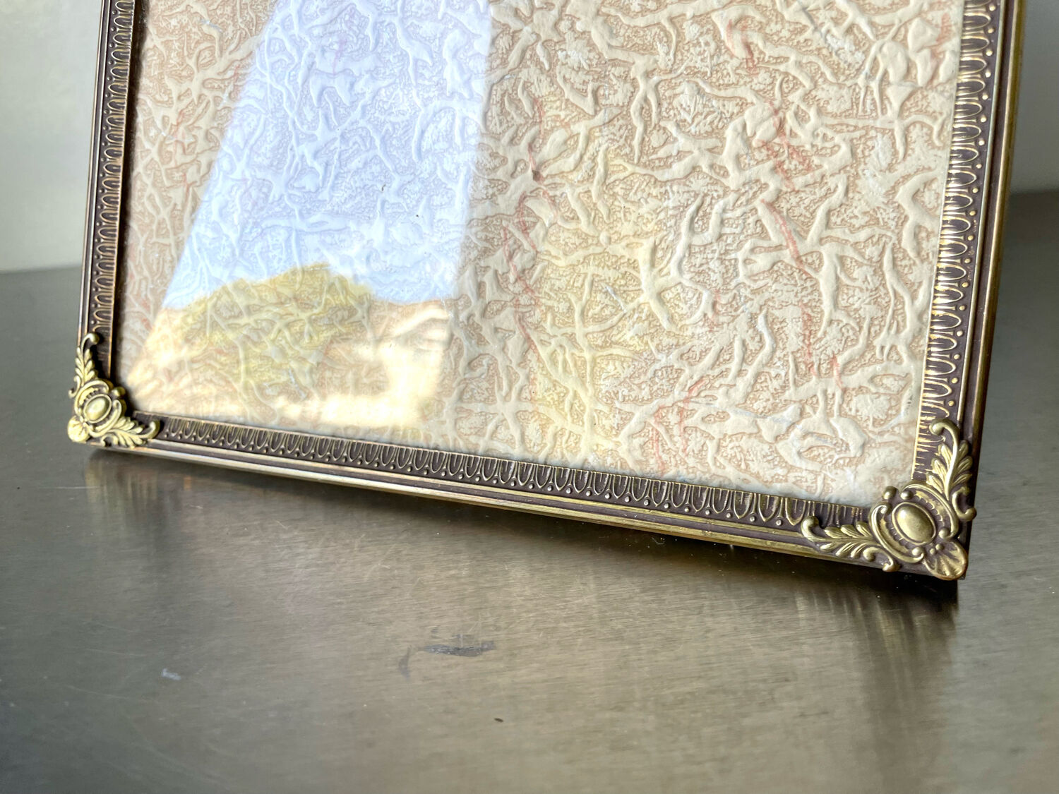 Metal vintage frame in gold colored brass