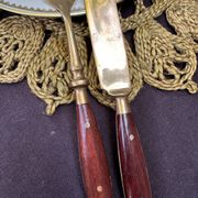 Wood and brass serving utensils