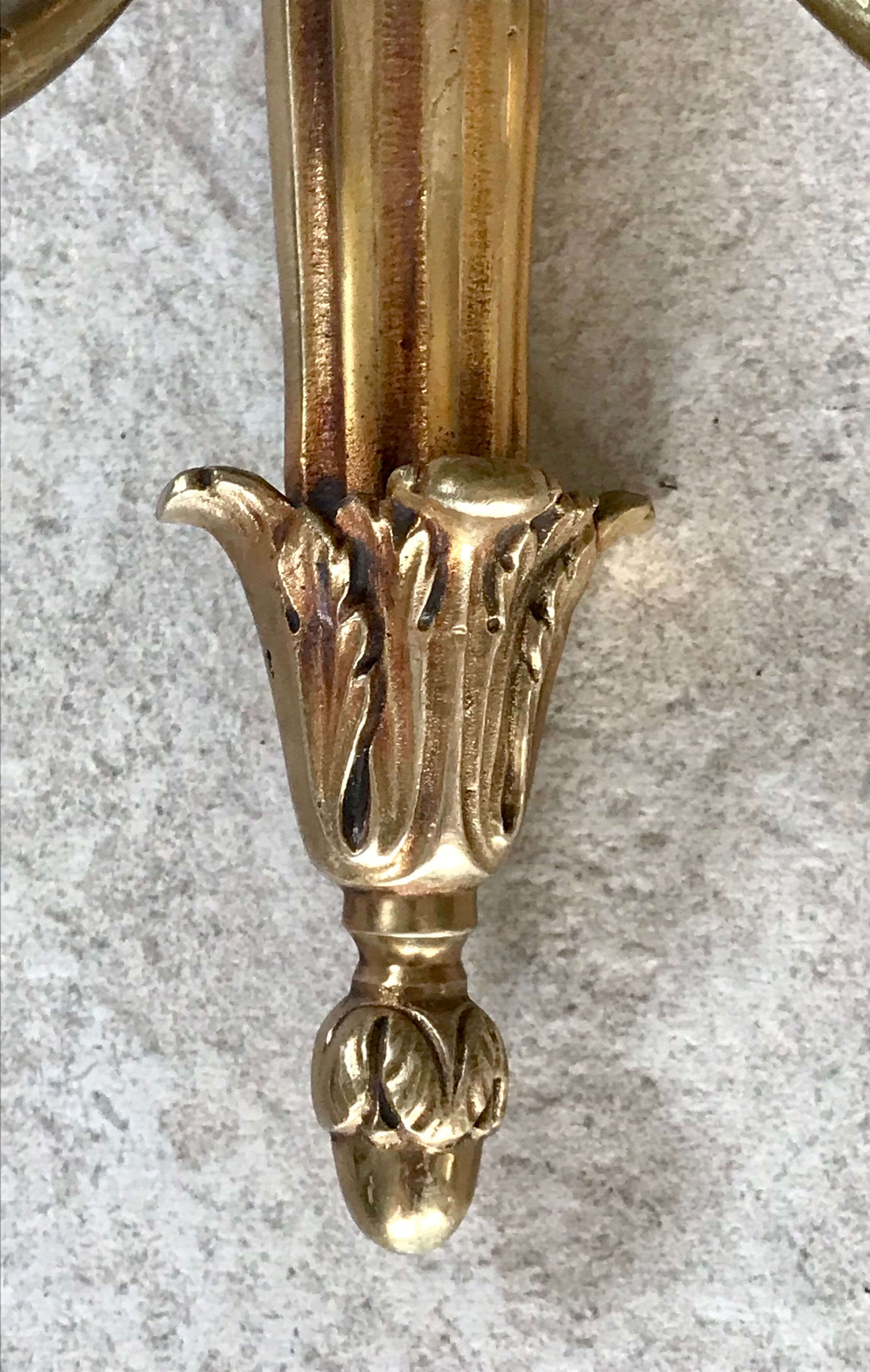 Pair of gilded bronze wall lamps