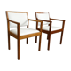 pair of Scandinavian teak armchairs and white buckles