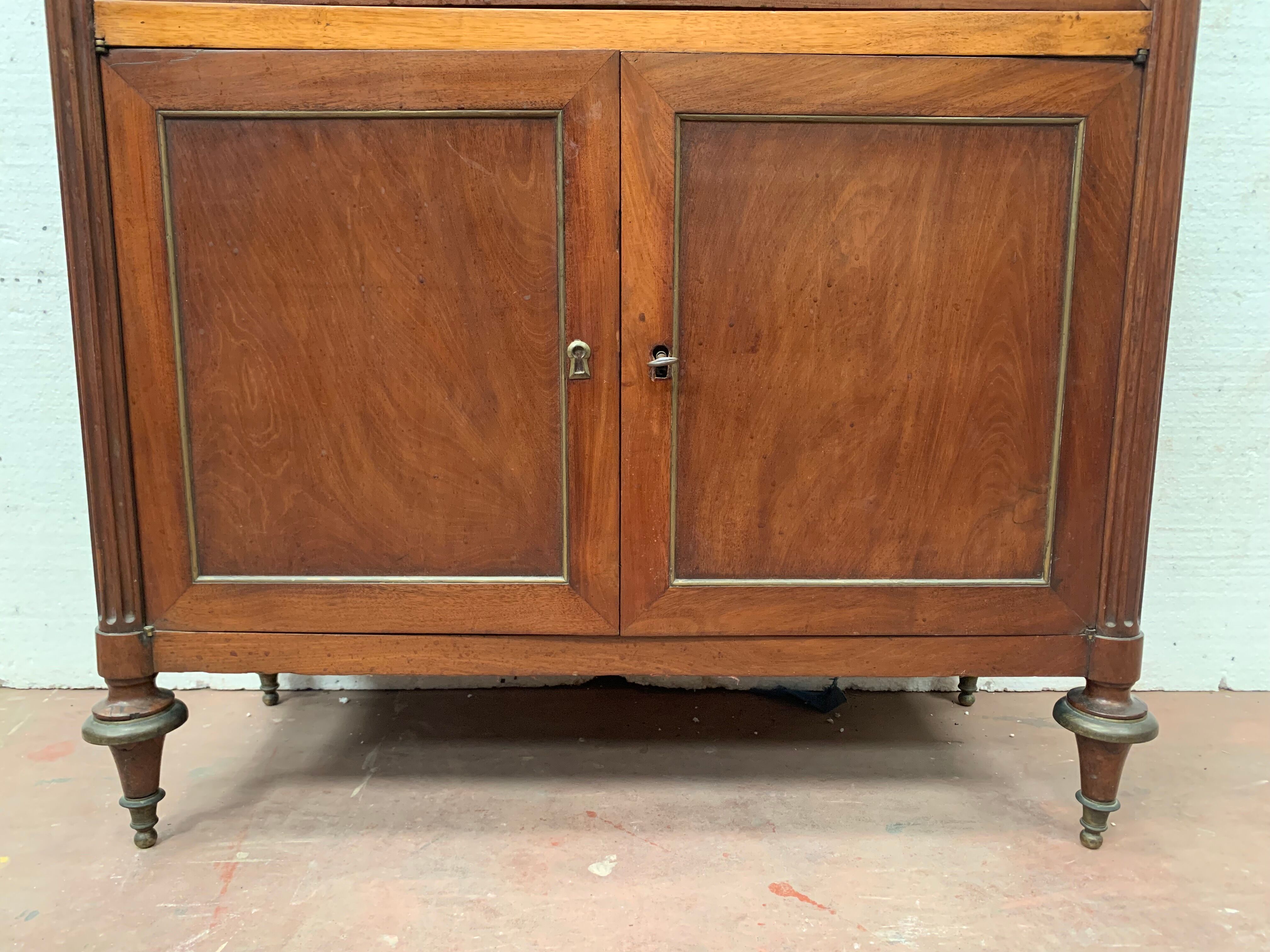 Secretary Louis XVI in mahogany Top of veined gray marble XIX century