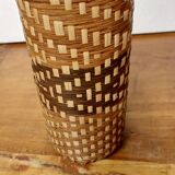 Old bottle dressed in wicker