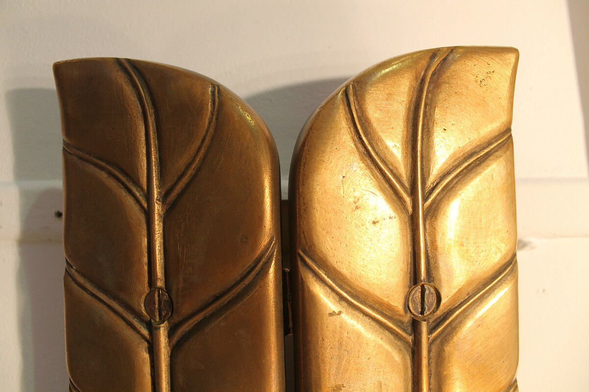 Applies in bronze "feathers"