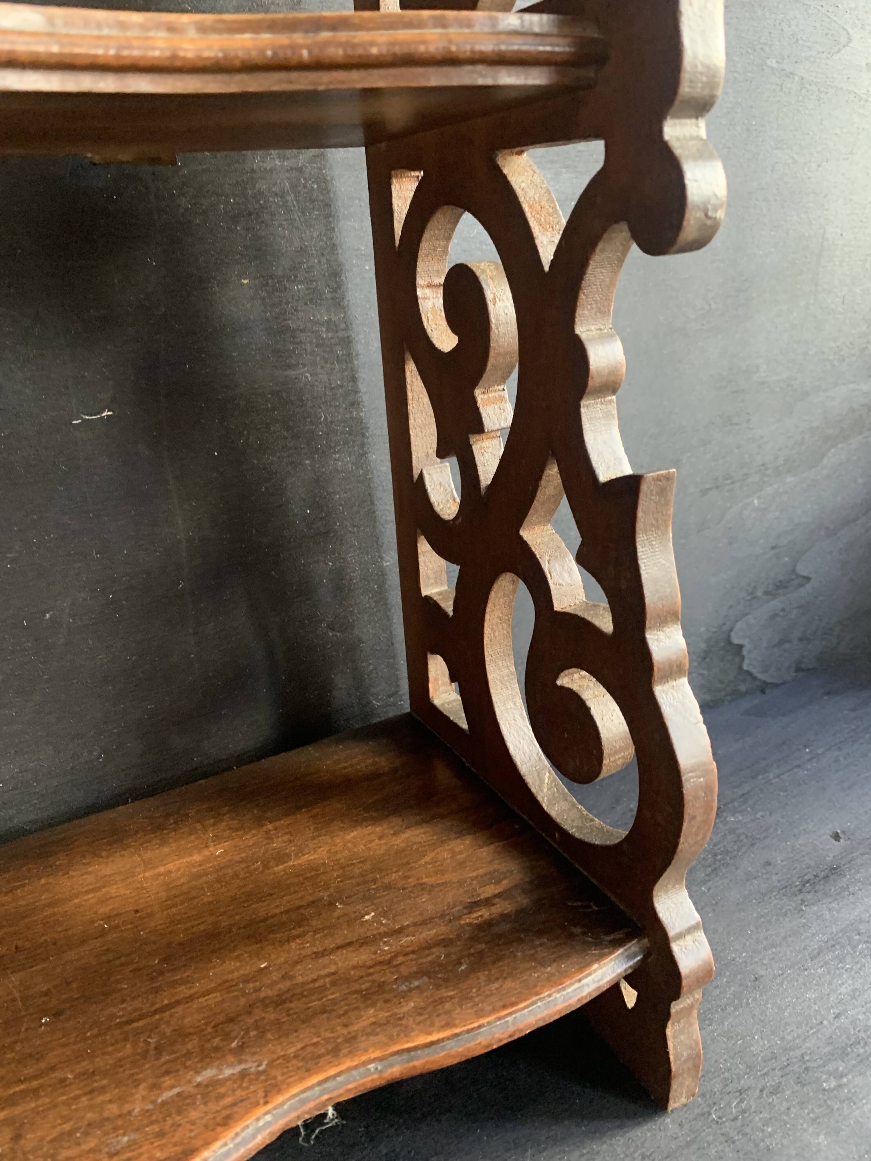 Antique shelf with openwork wooden pediment, early 20th century
