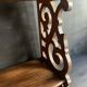 Antique shelf with openwork wooden pediment, early 20th century