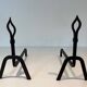 Pair of Modernist Andirons in Wrought Iron with Stylised Torches and Bases Ang