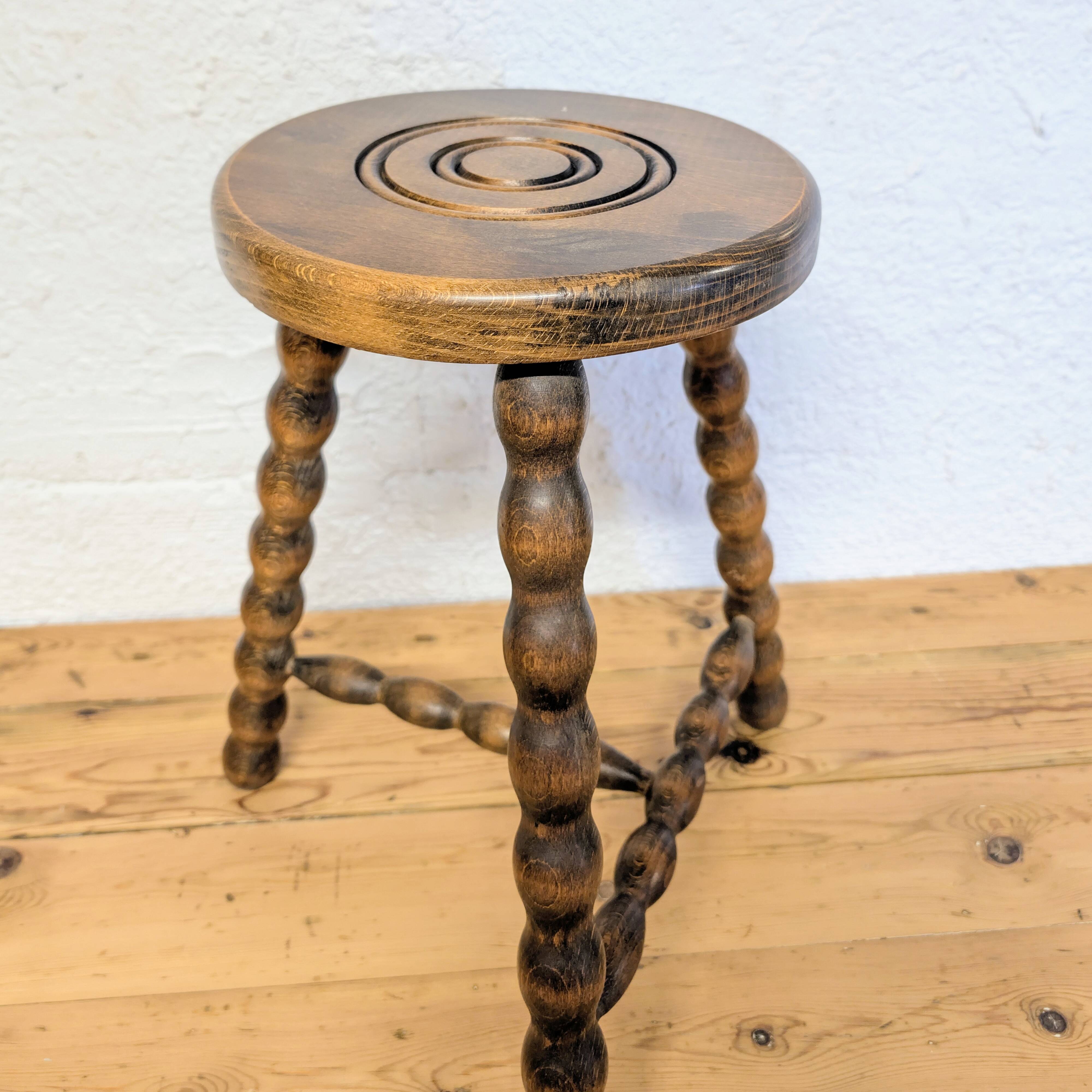 Turned wooden tripod stool