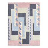 Hand-knotted wool rug by Tisca with a geometric pattern, signed "ILES", France, 1990s.