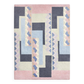 Hand-knotted wool rug by Tisca with a geometric pattern, signed "ILES", France, 1990s.
