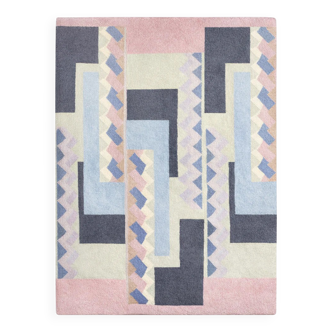 Hand-knotted wool rug by Tisca with a geometric pattern, signed "ILES", France, 1990s.