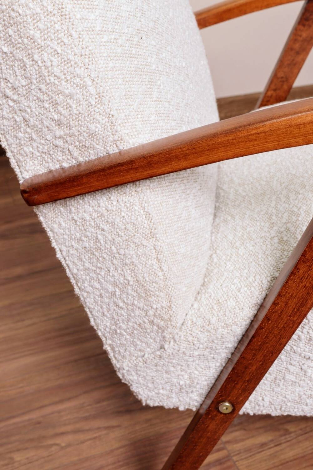 Vintage armchair in pearl bouclé, mid-century modern design from the 1960s.