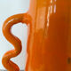 Handmade abstract orange ceramic vase with wavy handles