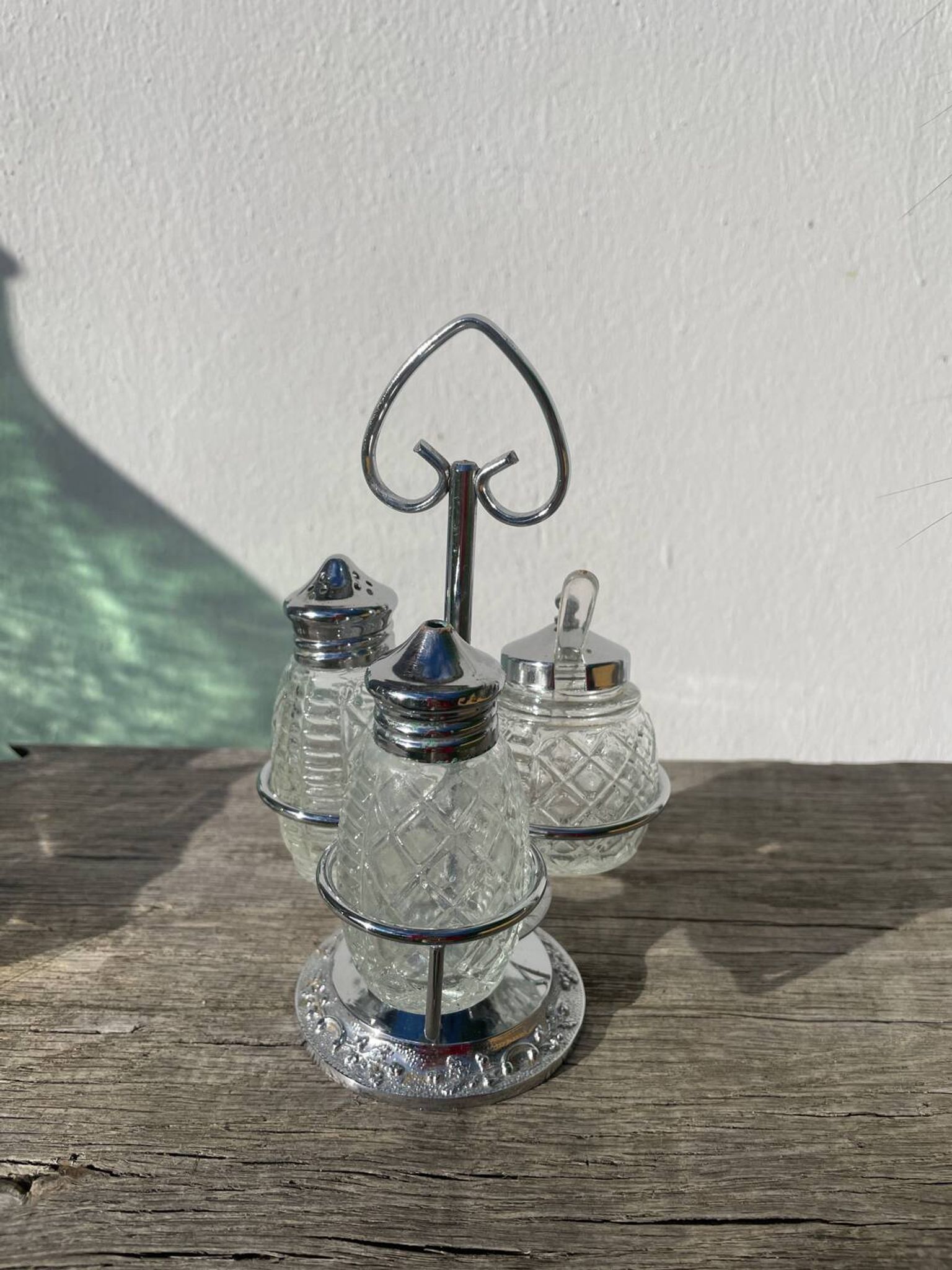 Silver-plated metal and glass salt and pepper shakers