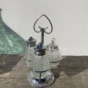 Silver-plated metal and glass salt and pepper shakers