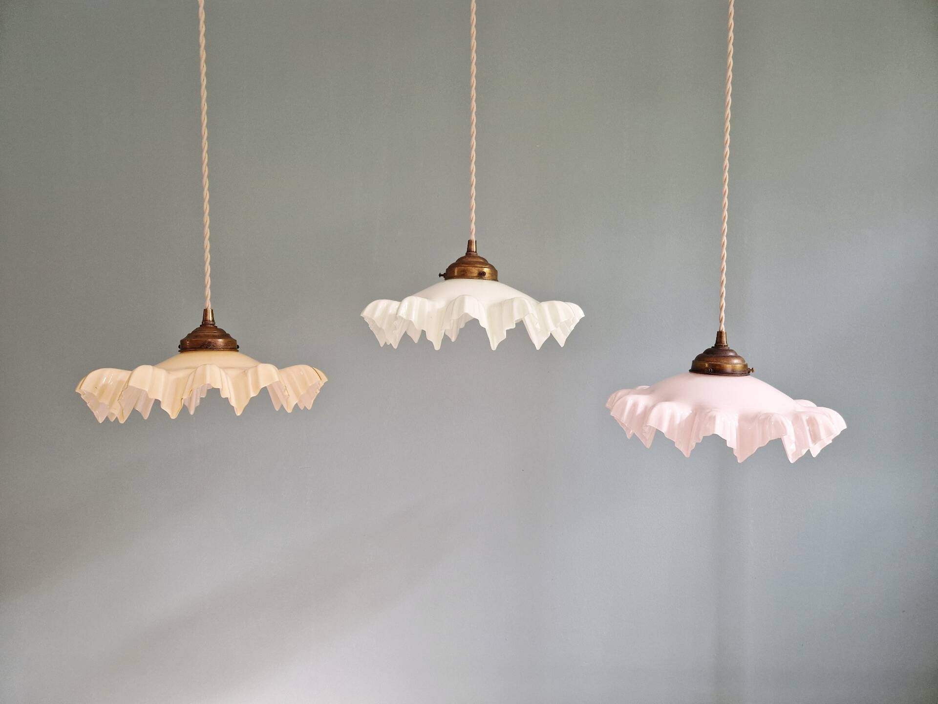 Art Deco trio of suspensions in coloured frilled opaline, 1920-30.