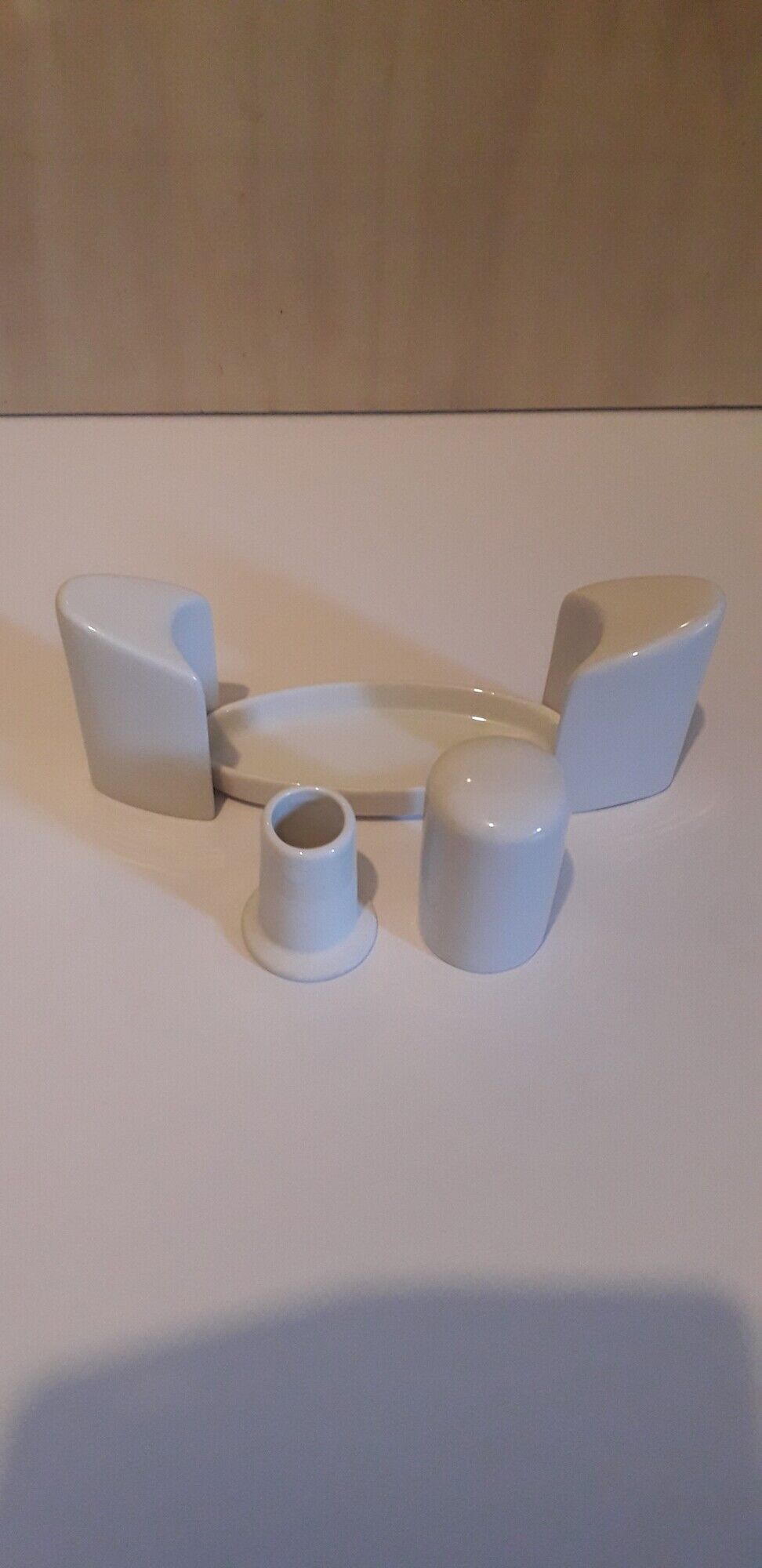Set salt shaker, pepper tree and covered ceramic pot on small tray