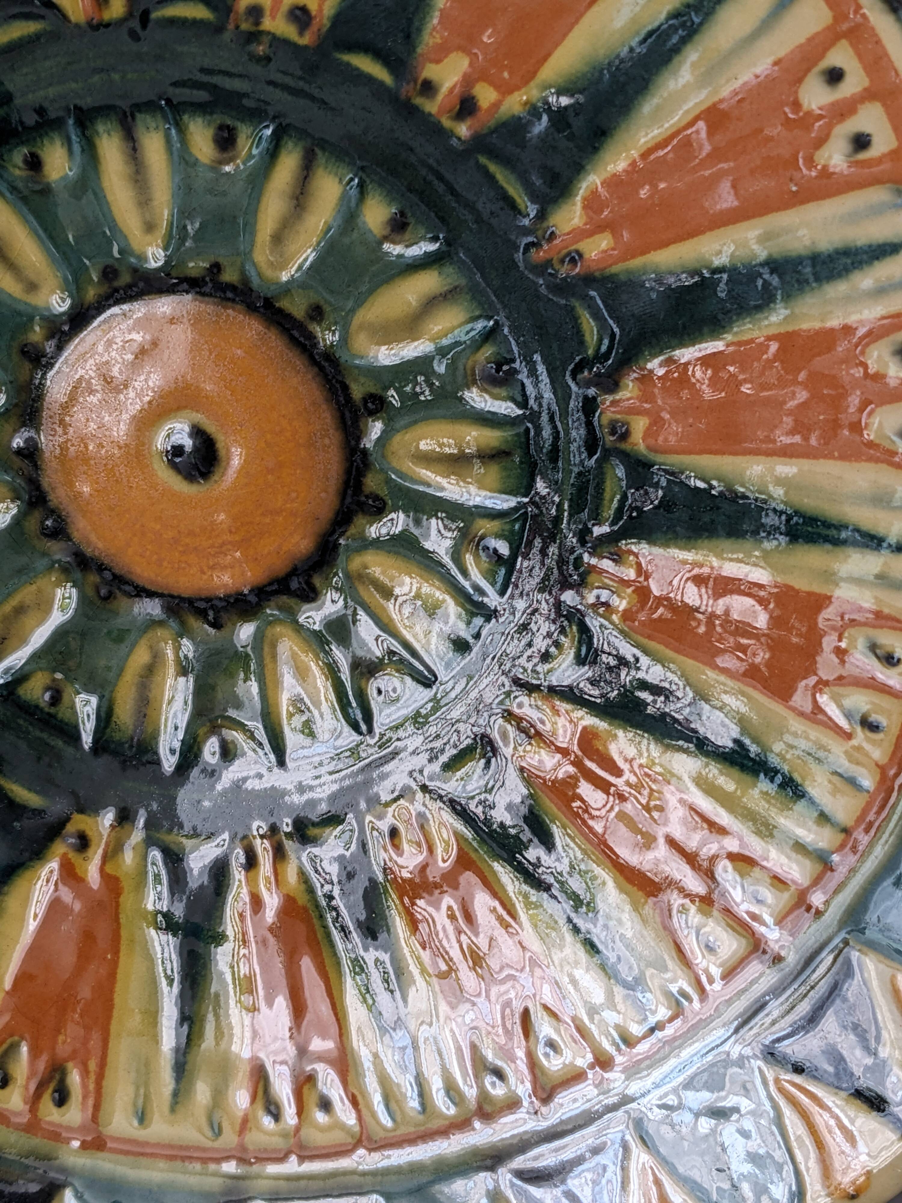 Vintage ceramic plate with enamel decoration