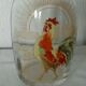 Glass carafe with enamel decoration featuring a rooster, late 19th century.