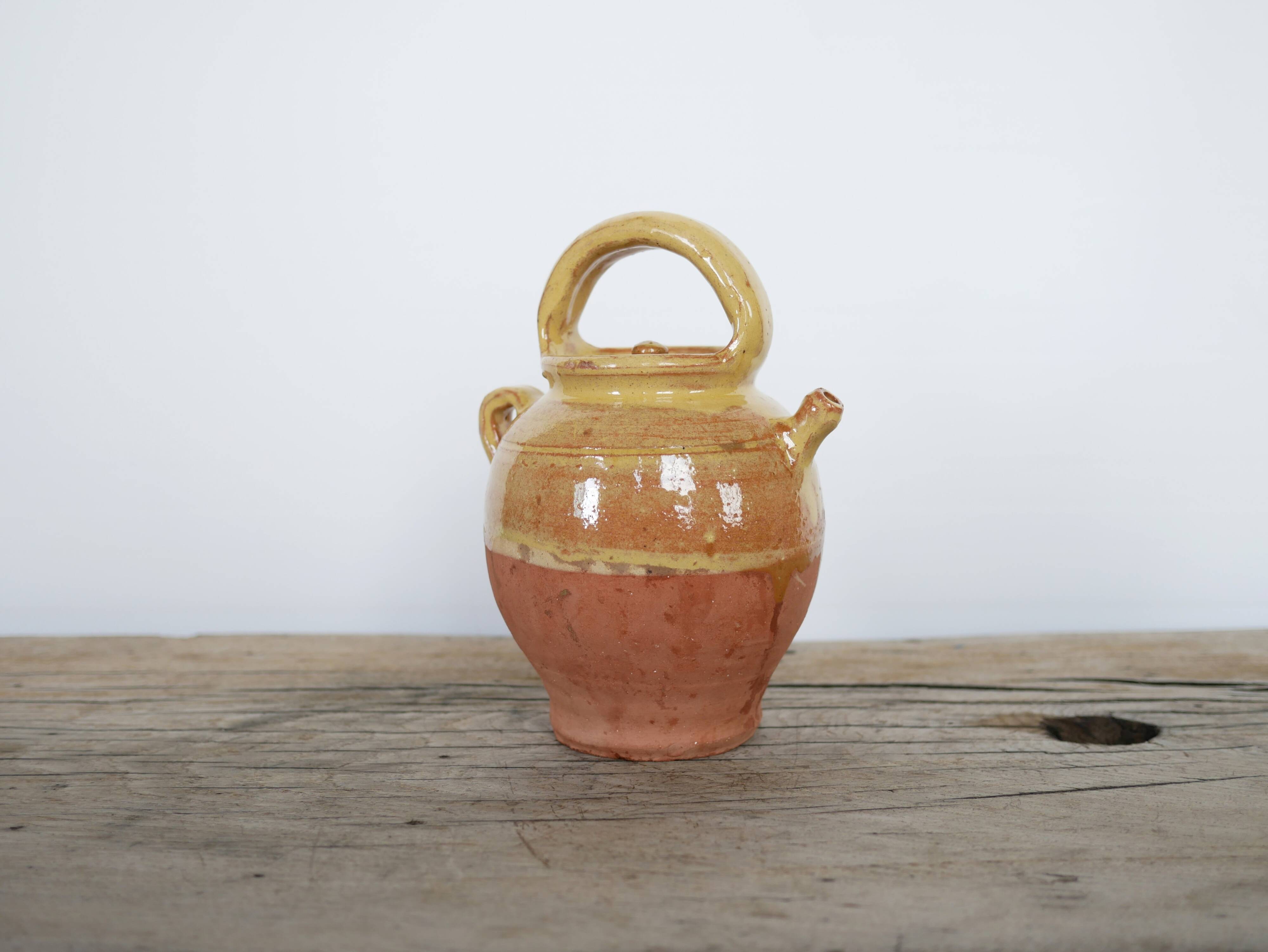 Old gargoulette pot in glazed terracotta