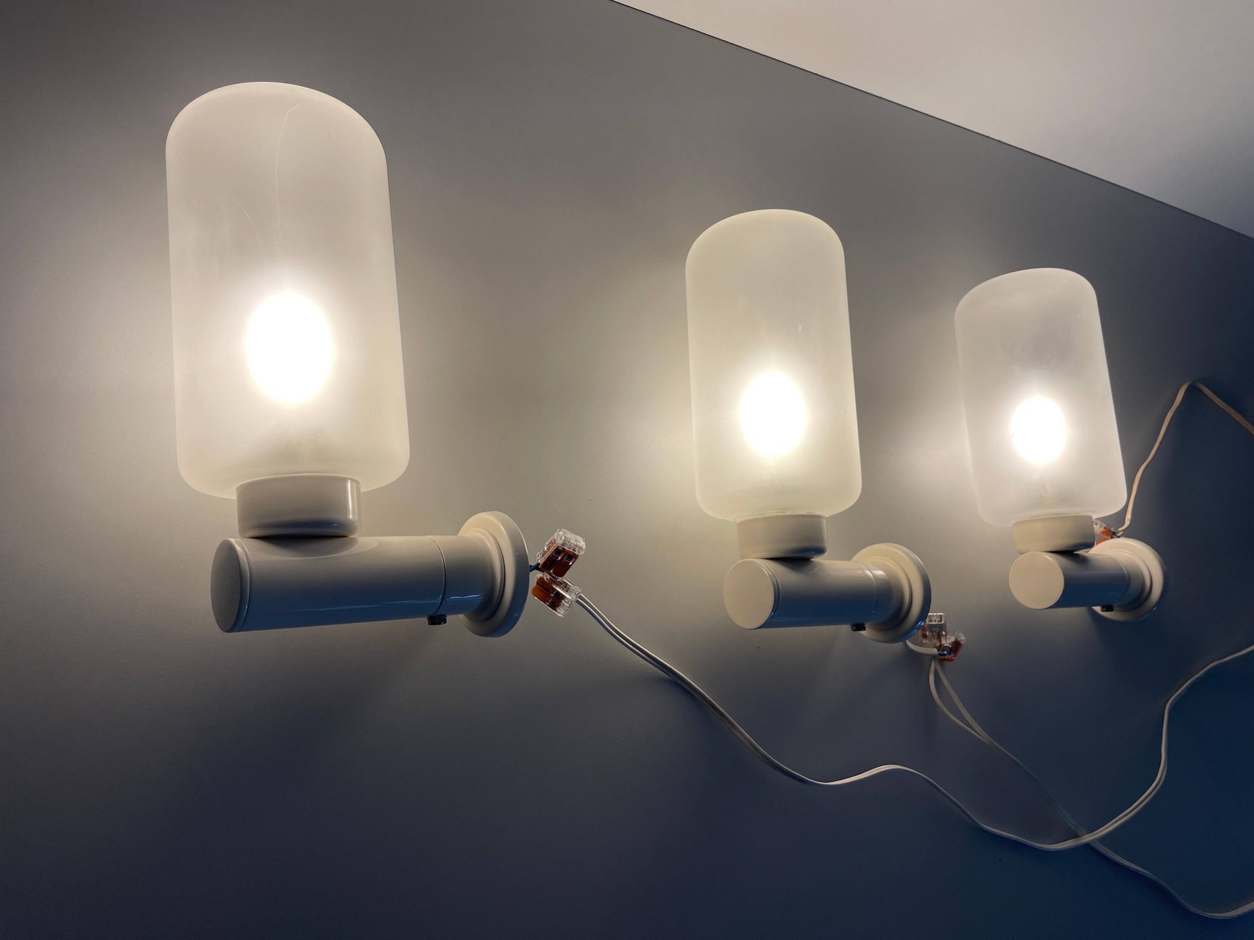 Set of 3 semi-transparent glass and white metal wall lights, 1960, Germany