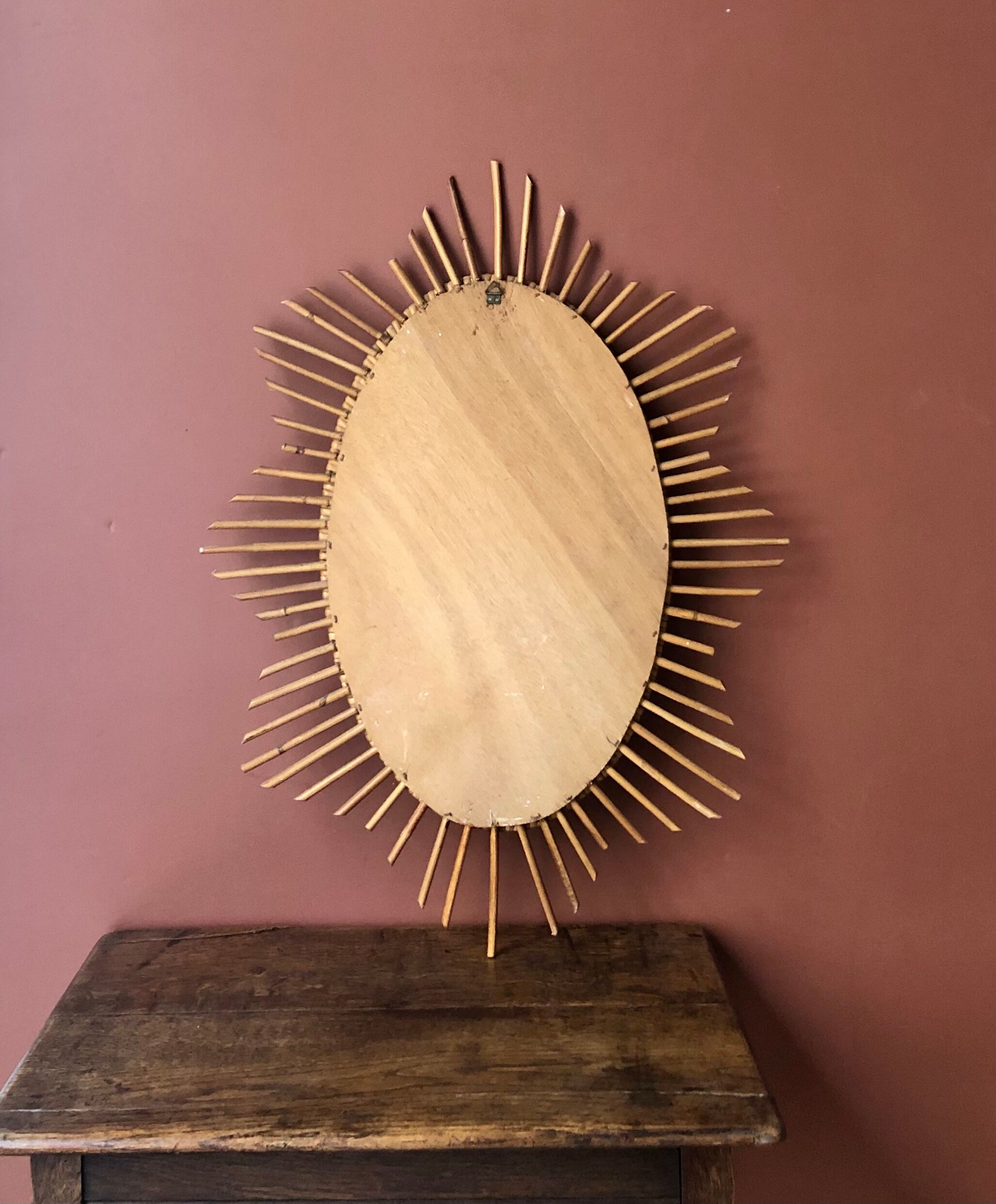 Oval rattan sun mirror