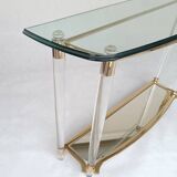 Hollywood Regency console table in lucite, glass and gold metal. 1980s