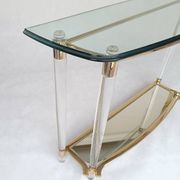 Hollywood Regency console table in lucite, glass and gold metal. 1980s