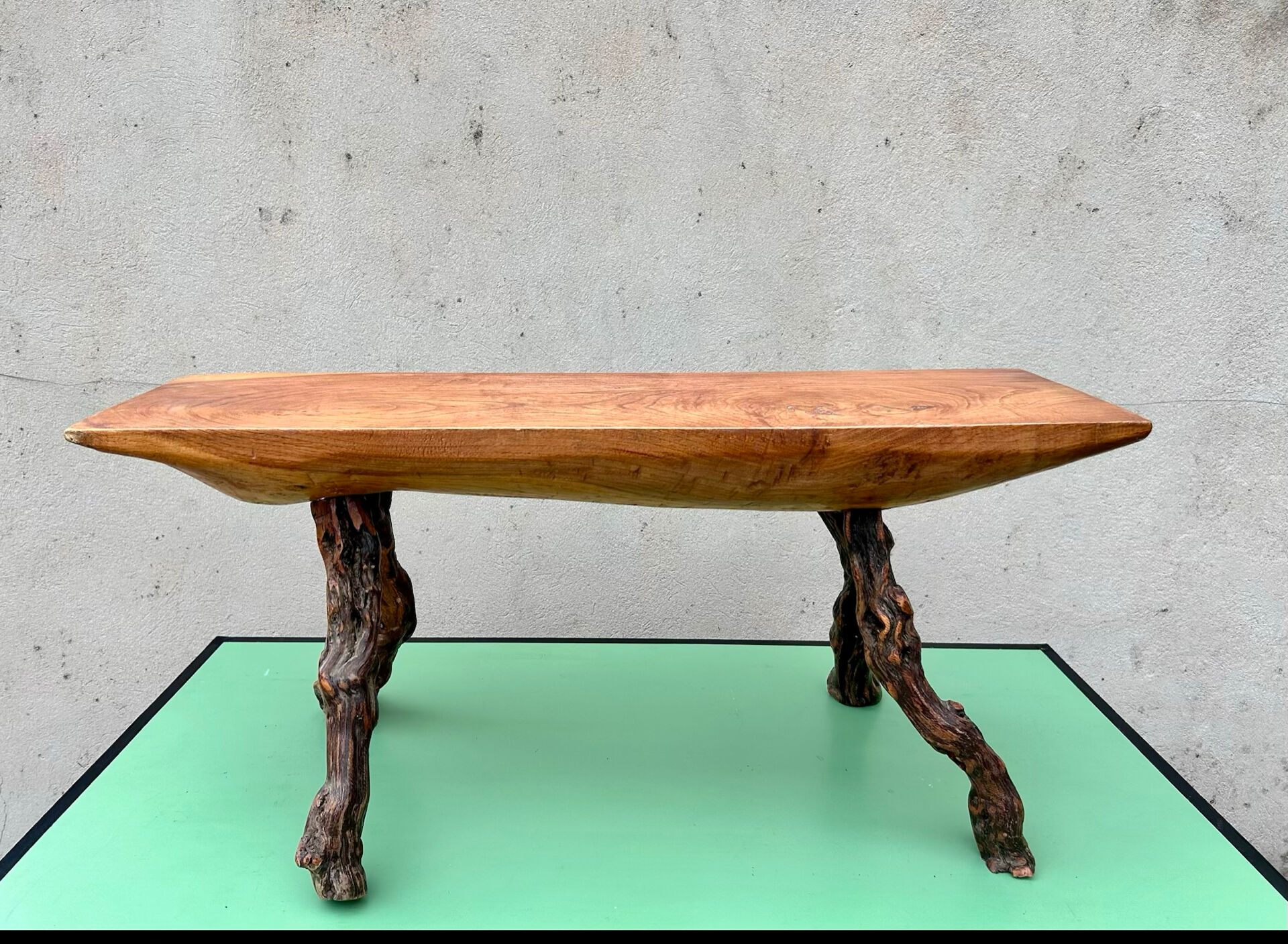 Brutalist bench made of vine and olive wood.