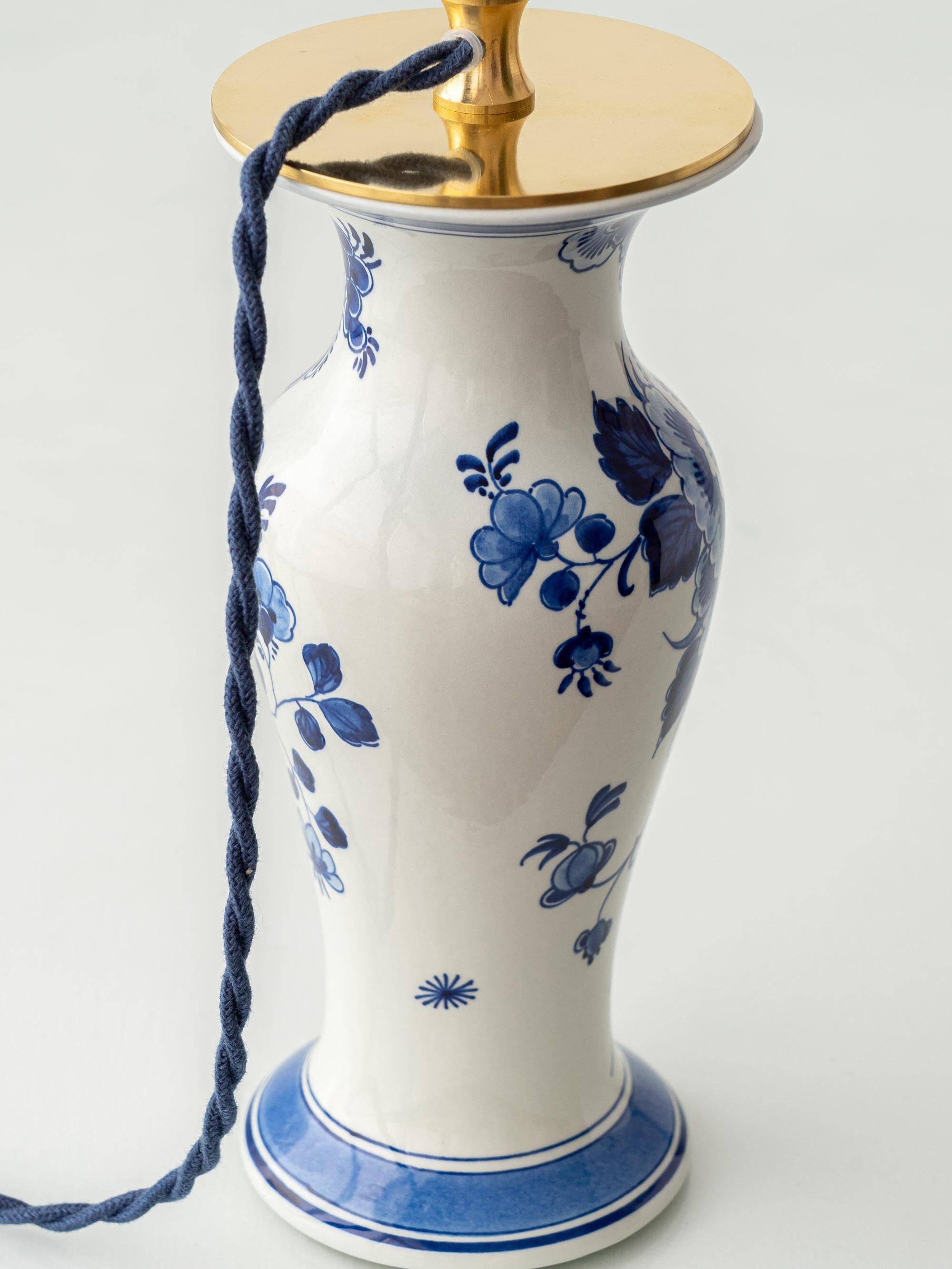 Pair of Chinese table lamps in Delft blue ceramic with new green silk shades.