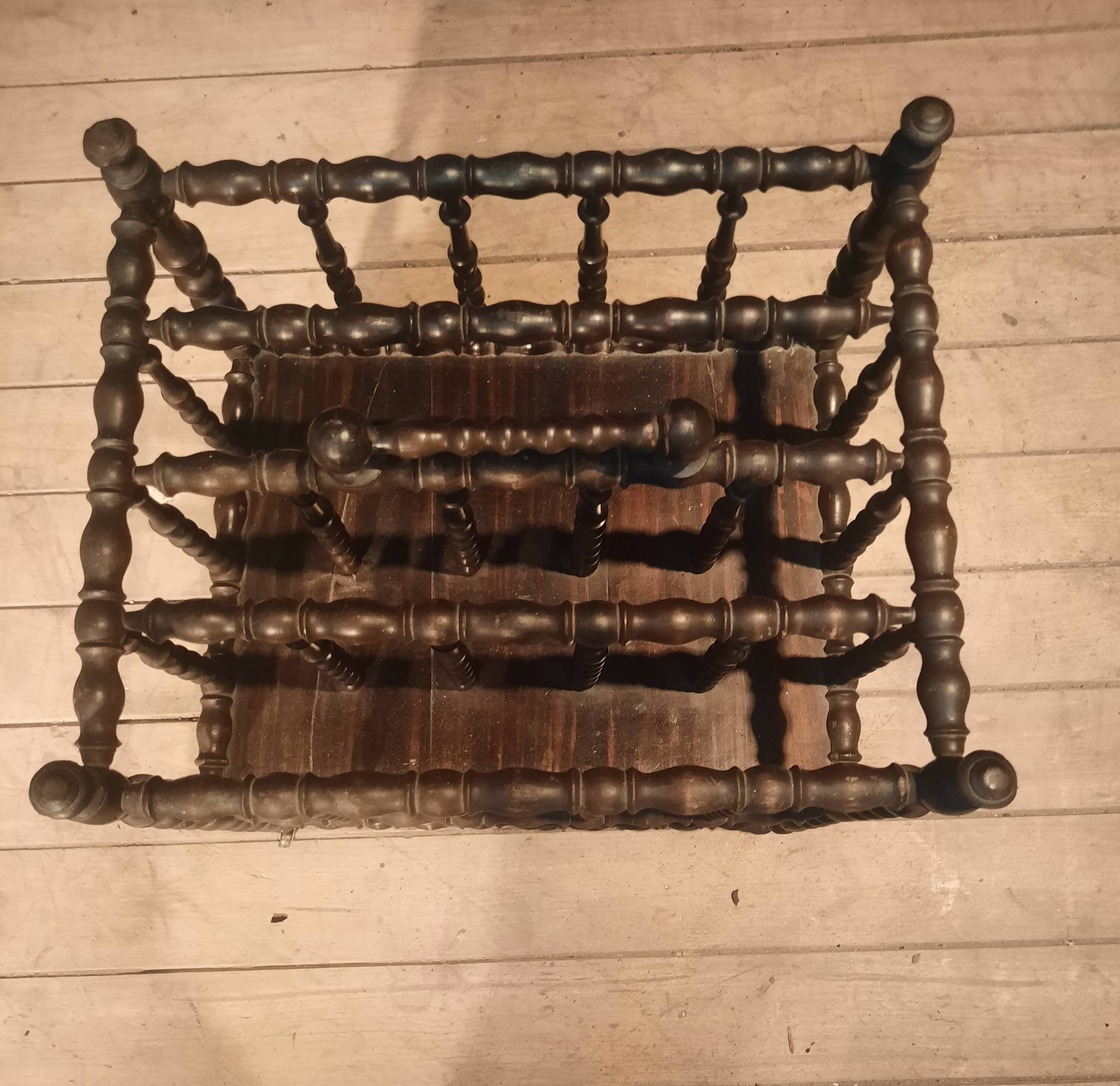 Rosewood magazine rack on casters