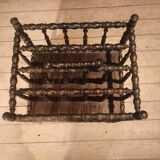 Rosewood magazine rack on casters