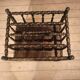 Rosewood magazine rack on casters