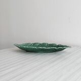 Green earthenware dish in the shape of a leaf