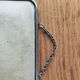 Vintage barber mirror with chain.