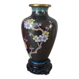 Small black cloisonné vase decorated with yellow and pink cherry blossoms, vase on wooden base