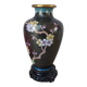 Small black cloisonné vase decorated with yellow and pink cherry blossoms, vase on wooden base