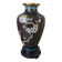 Small black cloisonné vase decorated with yellow and pink cherry blossoms, vase on wooden base