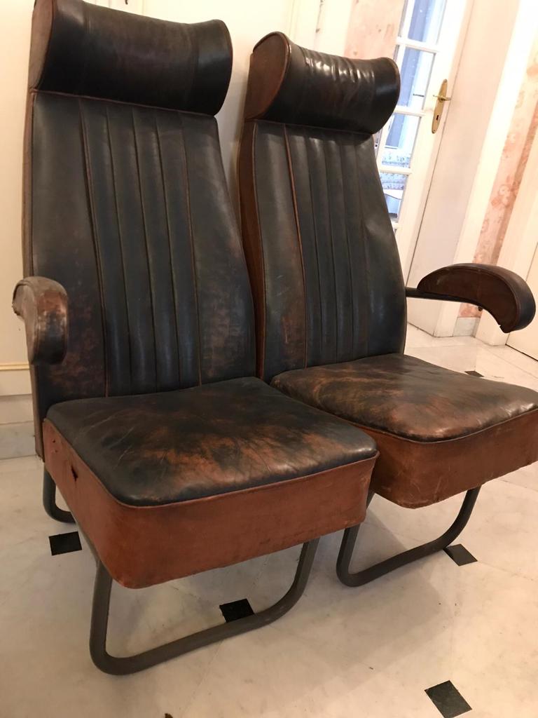 Vintage 1950s leather double-plane bus armchairs