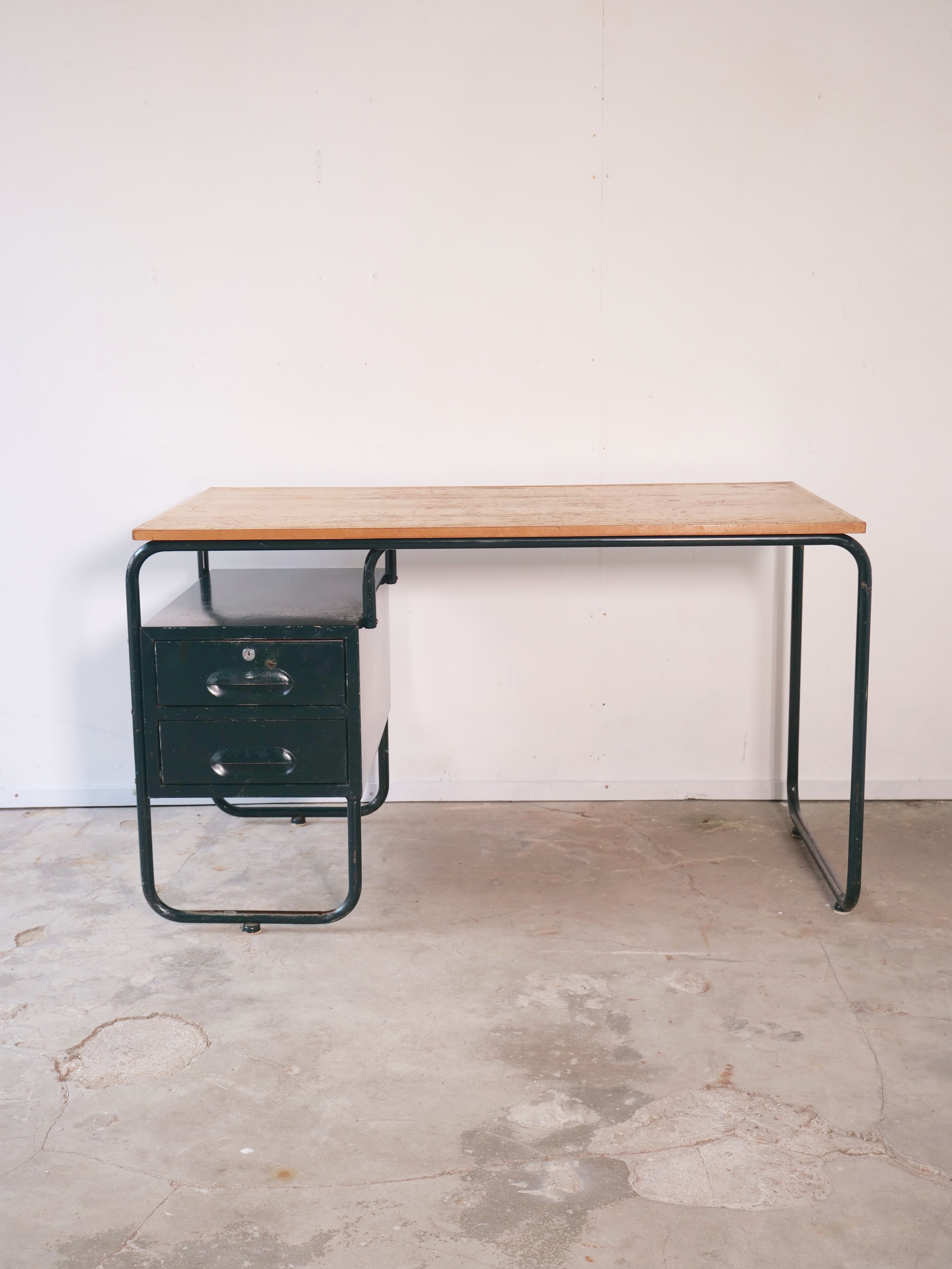 Desk with bauhaus style tubular steel chair