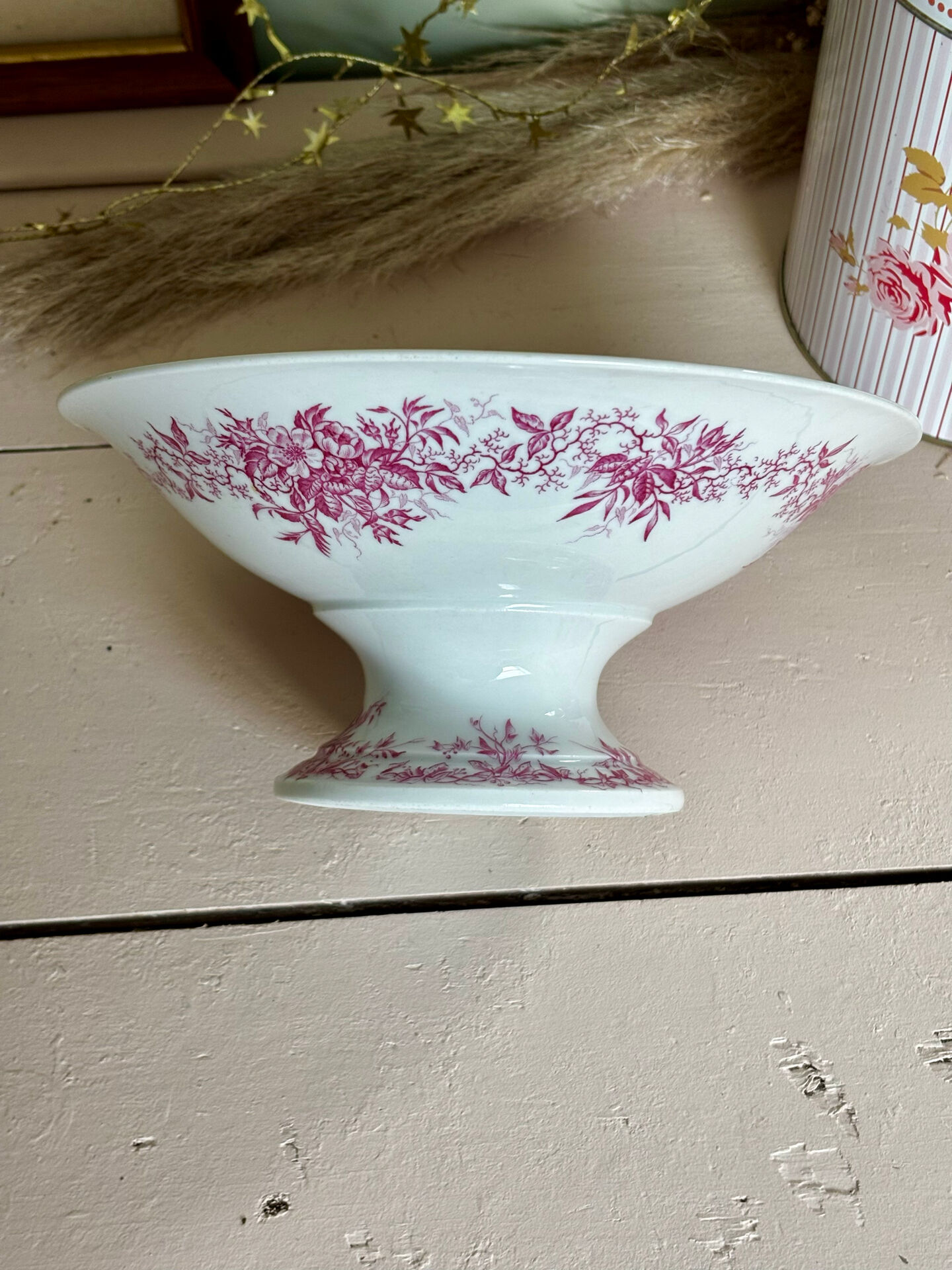 Magnificent antique compote fine porcelain with pink floral decoration.