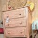 Small Parisian-style chest of drawers patinated in pink.