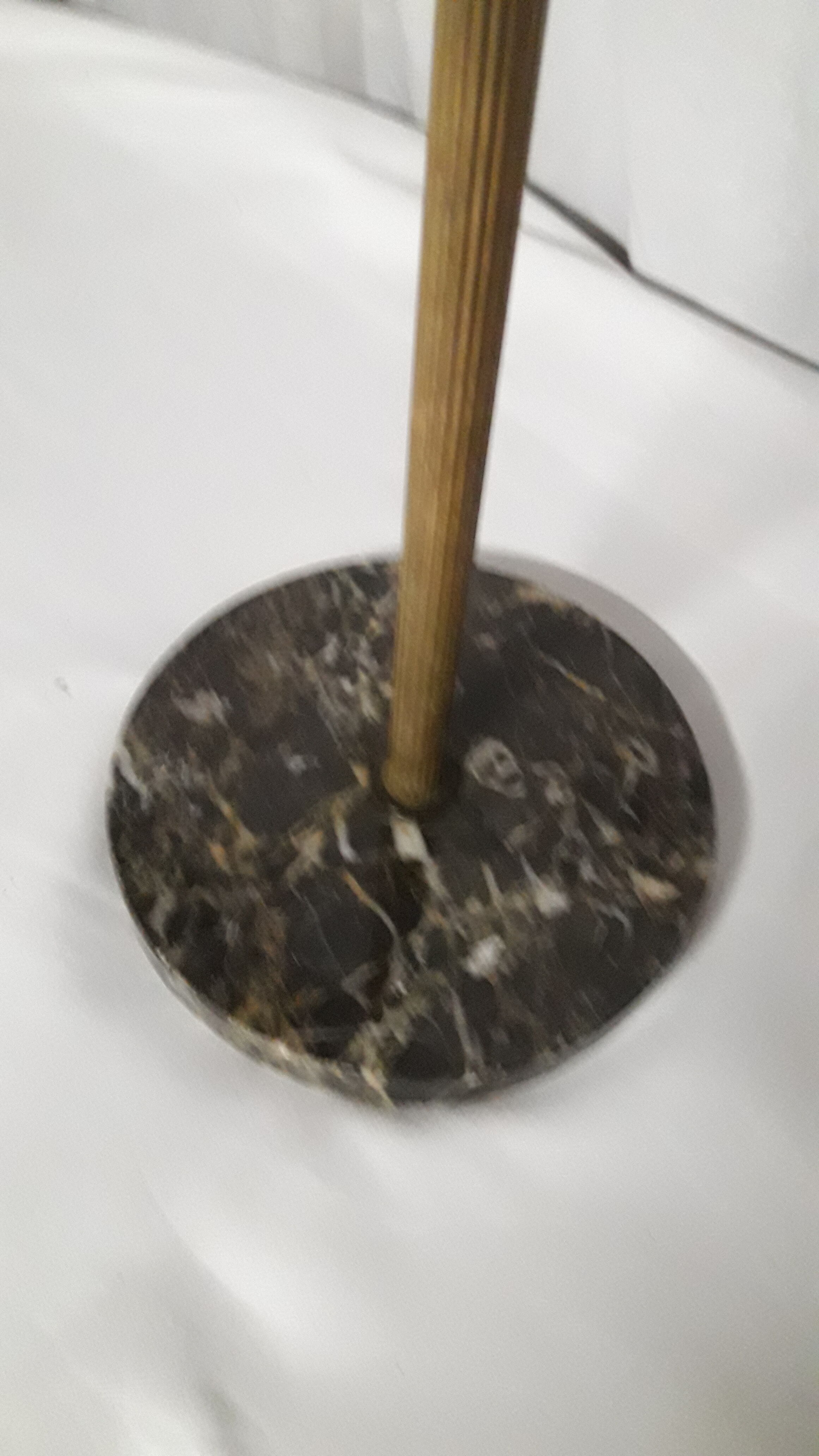 Gold metal standing ashtray and black marble base