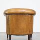 Fauteuil en cuir de mouton et clous de tapissier