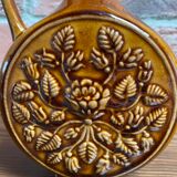 German round vase with floral motif, ornamental brown ceramic jug with handle
