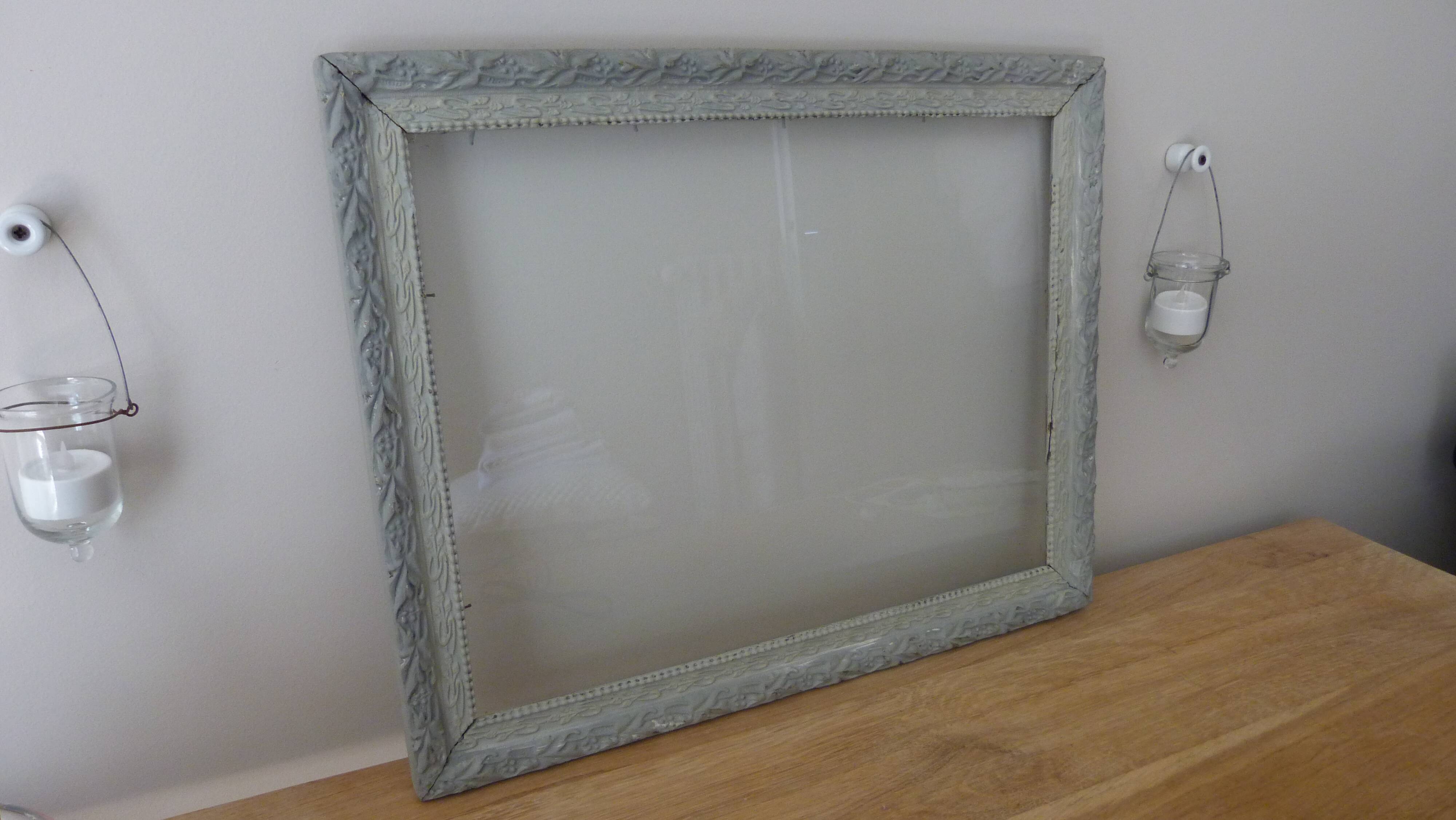 Patinated frame with glass