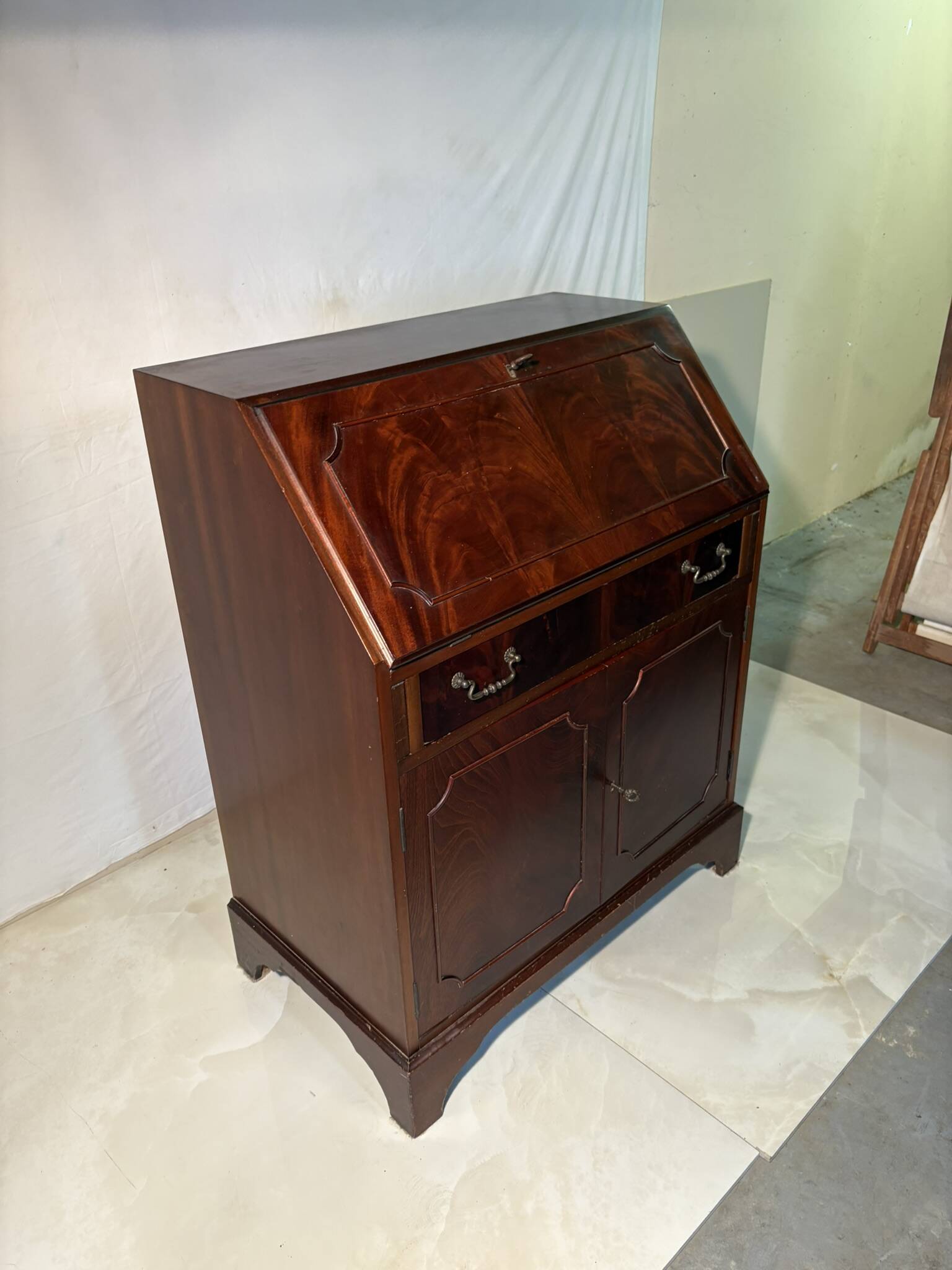 Antique mahogany secretary, upholstered flap and interior storage