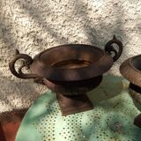 Former pair of iron cast Medici planters